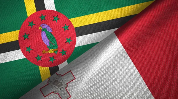 Dominica en Malta twee vlaggen textiel doek, weefsel textuur — Stockfoto