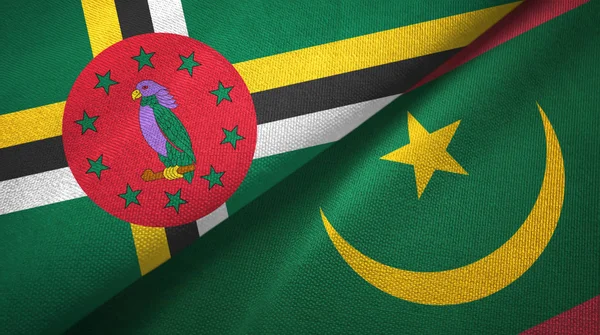Dominique et Mauritanie deux drapeaux tissu textile, texture du tissu — Photo