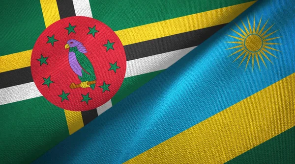 Dominica y Ruanda dos banderas tela textil, textura de la tela — Foto de Stock
