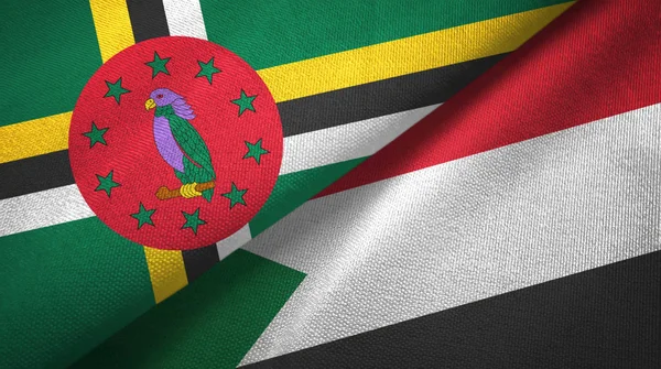 Dominica e Sudan due bandiere tessuto, tessitura tessuto — Foto Stock