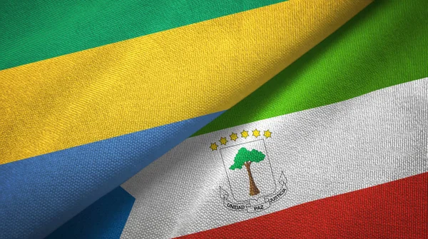 Gabão e Guiné Equatorial duas bandeiras de pano têxtil, textura de tecido — Fotografia de Stock