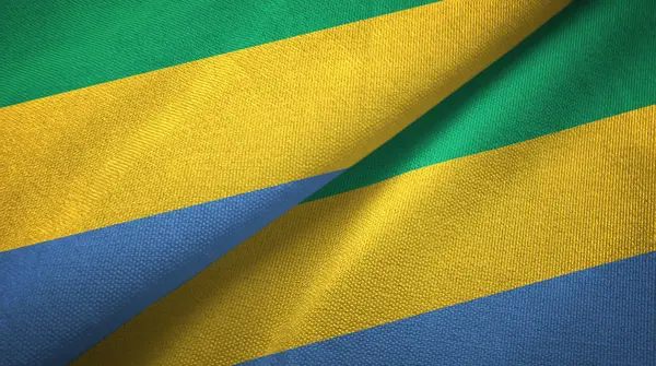 Gabon dwie flagi tkanina tekstylna, tekstura tkaniny — Zdjęcie stockowe