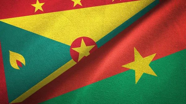 Grenada e Burkina Faso due bandiere tessuto, tessitura del tessuto — Foto Stock