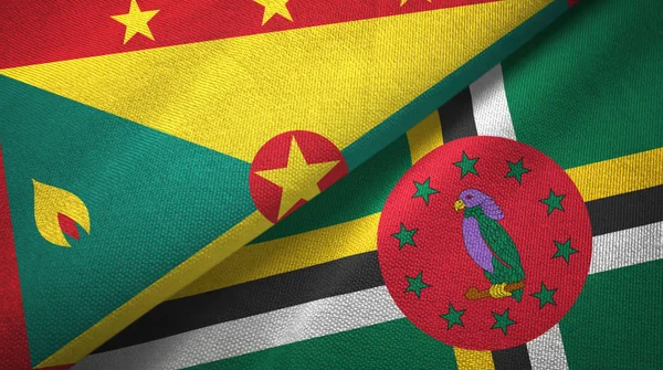 Grenada e Dominica due bandiere tessuto, tessitura tessuto — Foto Stock