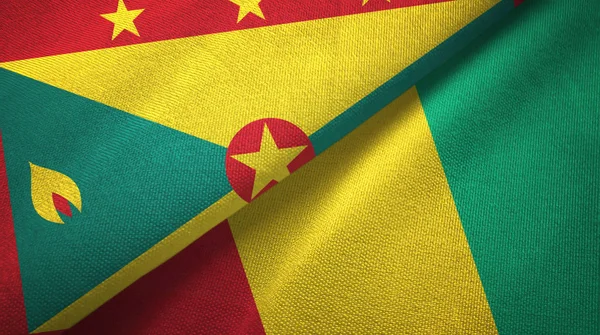 Grenada en Guinee twee vlaggen textiel doek, weefsel textuur — Stockfoto