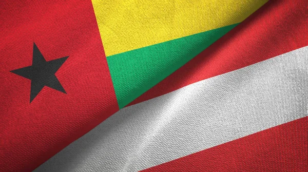 Guinea-Bissau und Österreich zwei Flaggen Gewebe, Gewebestruktur — Stockfoto