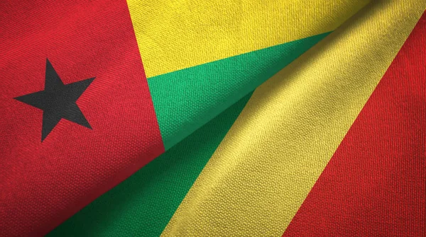 Guinea-Bissau y Congo dos banderas tela textil, textura de la tela — Foto de Stock