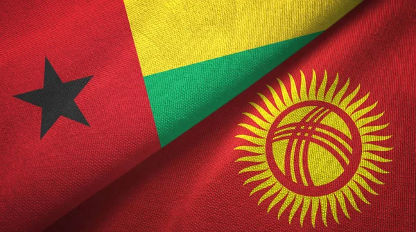 Guinea-Bissau y Kirguistán dos banderas tela textil, textura de la tela — Foto de Stock