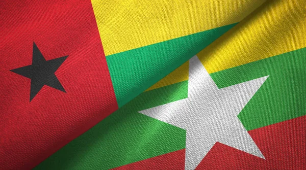 Guinea-Bissau und Myanmar zwei Flaggen Textiltuch, Textur — Stockfoto