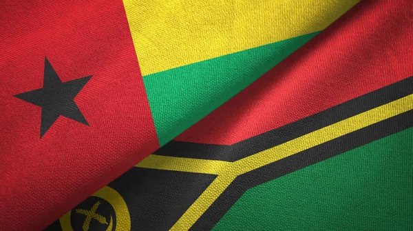 Guinea-Bissau y Vanuatu dos banderas tela textil, textura de la tela — Foto de Stock