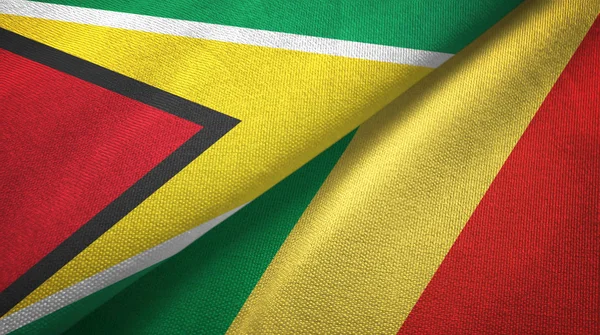 Guyana och Kongo två flaggor textil trasa, tyg konsistens — Stockfoto