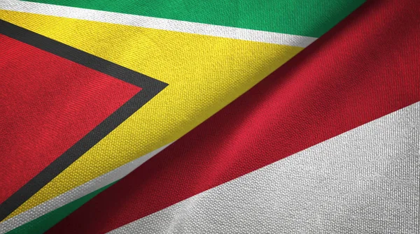 Guyana e Indonesia due bandiere tessuto, tessitura del tessuto — Foto Stock