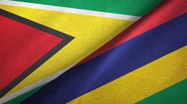 Guyana y Mauricio dos banderas tela textil, textura de la tela —  Fotos de Stock