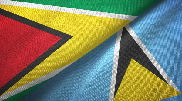 Guyana e Santa Lucia due bandiere tessuto, tessitura tessuto — Foto Stock
