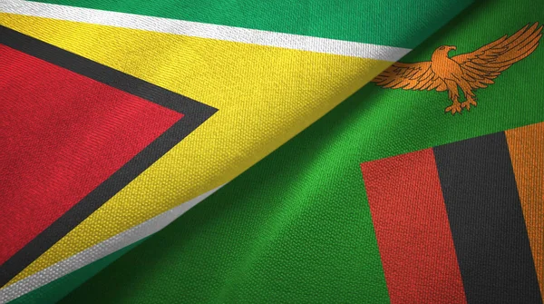 Guyana e Zambia due bandiere tessuto, tessitura del tessuto — Foto Stock