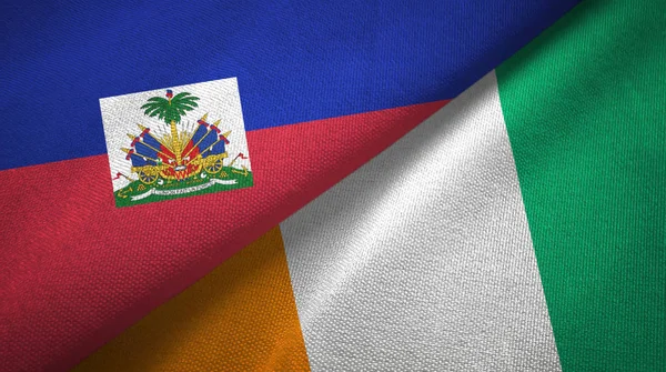 Haiti e Costa d'Avorio Costa d'Avorio due bandiere tessuto texture — Foto Stock