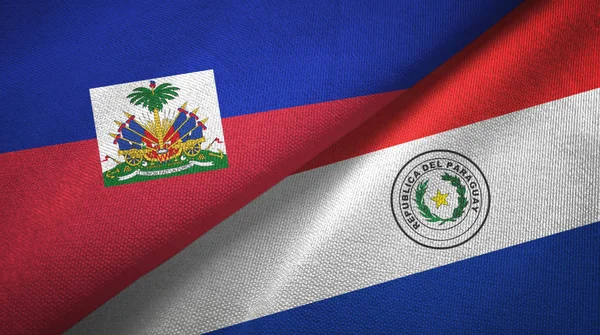 Haïti en Paraguay twee vlaggen textiel doek, weefsel textuur — Stockfoto
