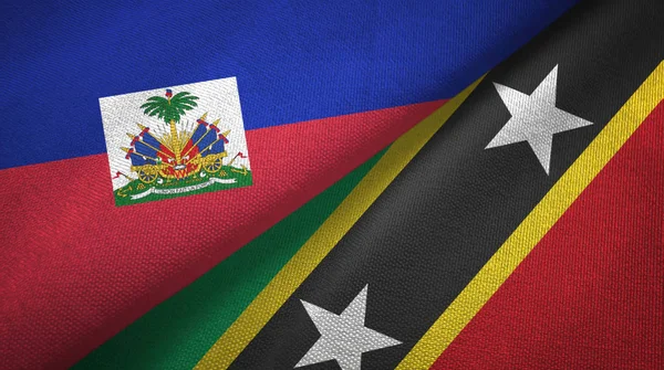 Haïti en Saint Kitts en Nevis twee vlaggen textiel doek, stof textuur — Stockfoto