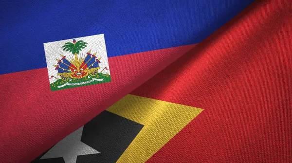 Haiti e Timor Est Timor Est due bandiere tessuto, trama del tessuto — Foto Stock