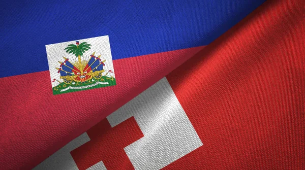 Haiti e Tonga due bandiere tessuto, tessitura tessuto — Foto Stock
