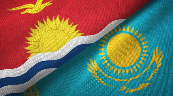 Kiribati e Kazakistan due bandiere tessuto, tessitura tessuto — Foto Stock