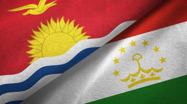 Kiribati y Tayikistán dos banderas tela textil, textura de la tela — Foto de Stock
