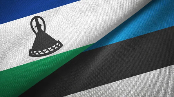 Lesotho a Estonsko dvě vlajky textilní tkaniny, textura textilií — Stock fotografie