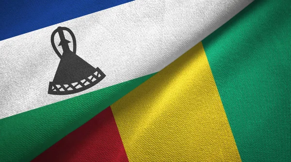 Lesotho a Guinea dvě vlajky textilní tkaniny, textura textilií — Stock fotografie