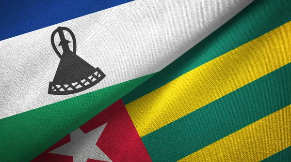Lesotho a Togo dvě vlajky textilní tkaniny, textura textilií — Stock fotografie