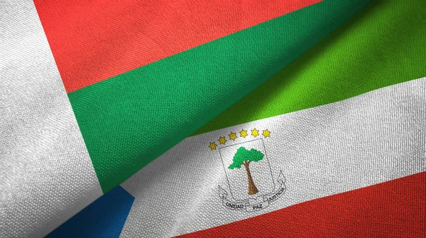 Madagascar and Equatorial Guinea two flags textile cloth, fabric texture — Stock Photo, Image