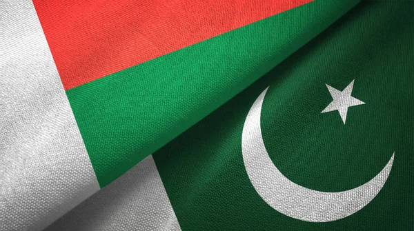 Madagascar and Pakistan two flags textile cloth, fabric texture — Stock Photo, Image