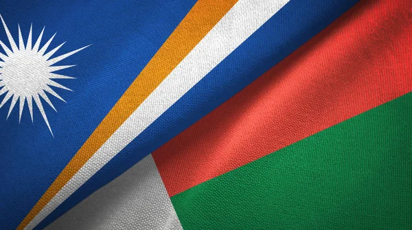 stock image Marshall Islands and Madagascar two flags textile cloth, fabric texture