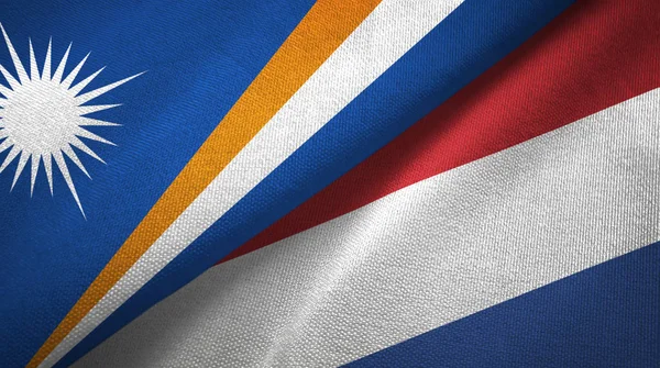 Isole Marshall e Paesi Bassi due bandiere tessuto, tessitura tessuto — Foto Stock