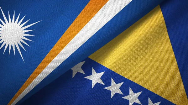 मार्शल द्वीप और बोस्निया और हर्जेगोविना दो झंडे वस्त्र कपड़े — स्टॉक फ़ोटो, इमेज