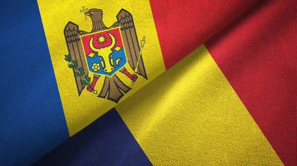 Moldavië en Tsjaad twee vlaggen textiel doek, weefsel textuur — Stockfoto