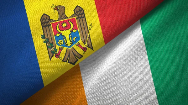 Moldavië en Cote DIVOIRE Ivoorkust twee vlaggen textielweefsel textuur — Stockfoto