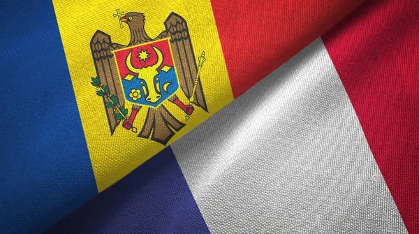 Moldavië en Frankrijk twee vlaggen textiel doek, weefsel textuur — Stockfoto