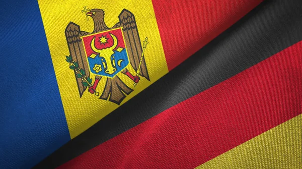 Moldova and Germany two flags textile cloth, fabric texture — Stock Photo, Image