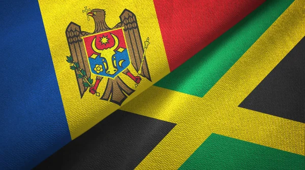 Moldávia e Jamaica duas bandeiras de pano têxtil, textura de tecido — Fotografia de Stock
