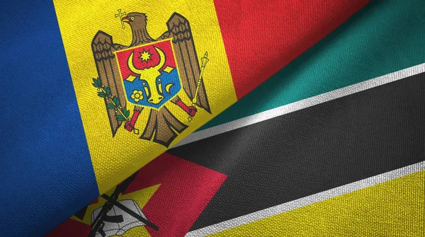 Moldavië en Mozambique twee vlaggen textiel doek, weefsel textuur — Stockfoto