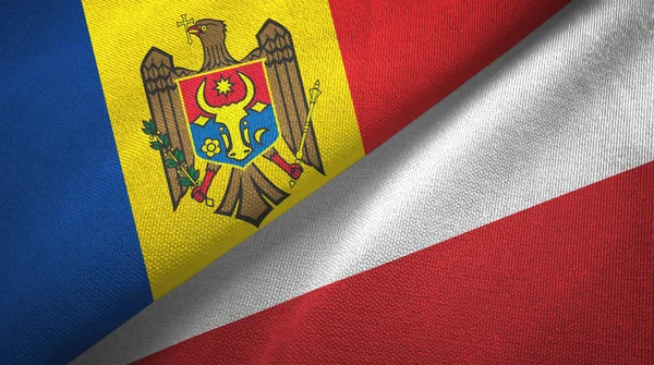 Moldavië en Polen twee vlaggen textiel doek, weefsel textuur — Stockfoto