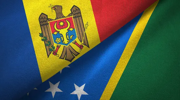 Moldavia y las Islas Salomón dos banderas tela textil, textura de la tela — Foto de Stock