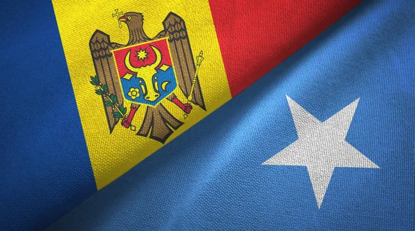 Moldávia e Somália duas bandeiras de pano têxtil, textura de tecido — Fotografia de Stock