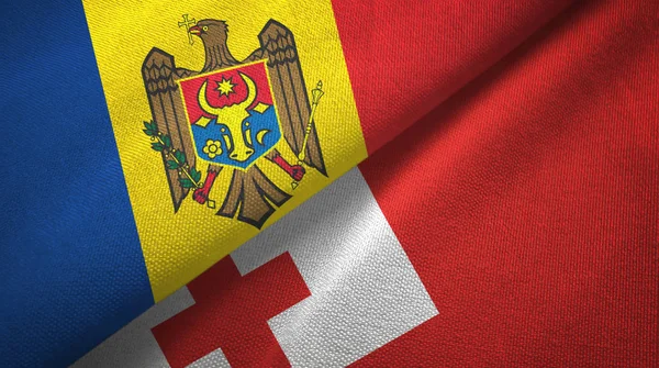 Moldavië en Tonga twee vlaggen textiel doek, weefsel textuur — Stockfoto