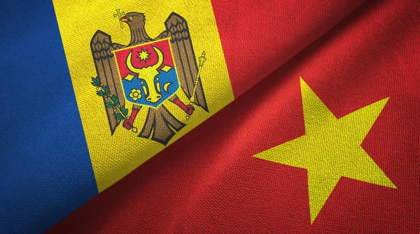 Moldavia y Vietnam dos banderas tela textil, textura de la tela — Foto de Stock