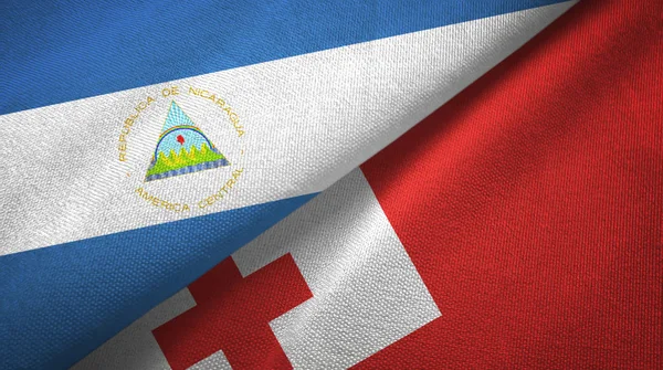 Nicaragua and Tonga two flags textile cloth, fabric texture — Stock Photo, Image