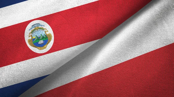 Costa Rica och Polen två flaggor textil tyg, tyg konsistens — Stockfoto