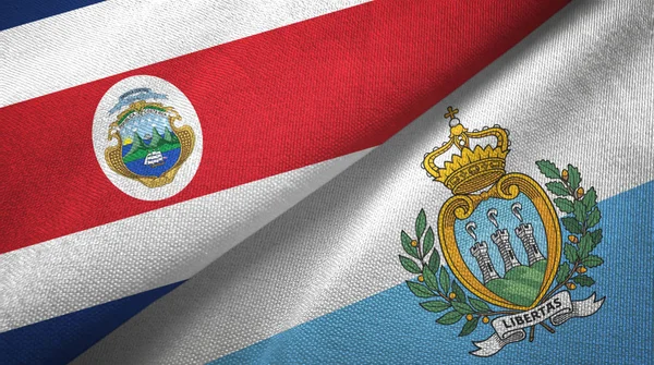 Costa Rica e San Marino due bandiere tessuto, tessitura tessuto — Foto Stock