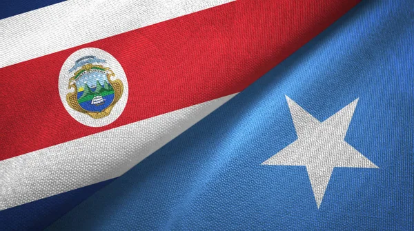 Costa Rica en Somalië twee vlaggen textiel doek, weefsel textuur — Stockfoto