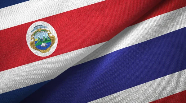 Costa Rica och Thailand två flaggor textil tyg, tyg konsistens — Stockfoto